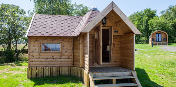 A premium quality camping cabin with steps.
